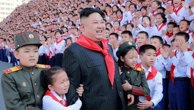 North Korean leader Kim Jong Un poses with participants during the 8th Congress of the Korean Children’s Union in Pyongyang